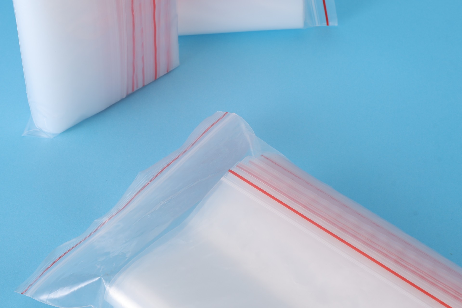 Close-up of the red press-close zipper track on PE ziplock bags