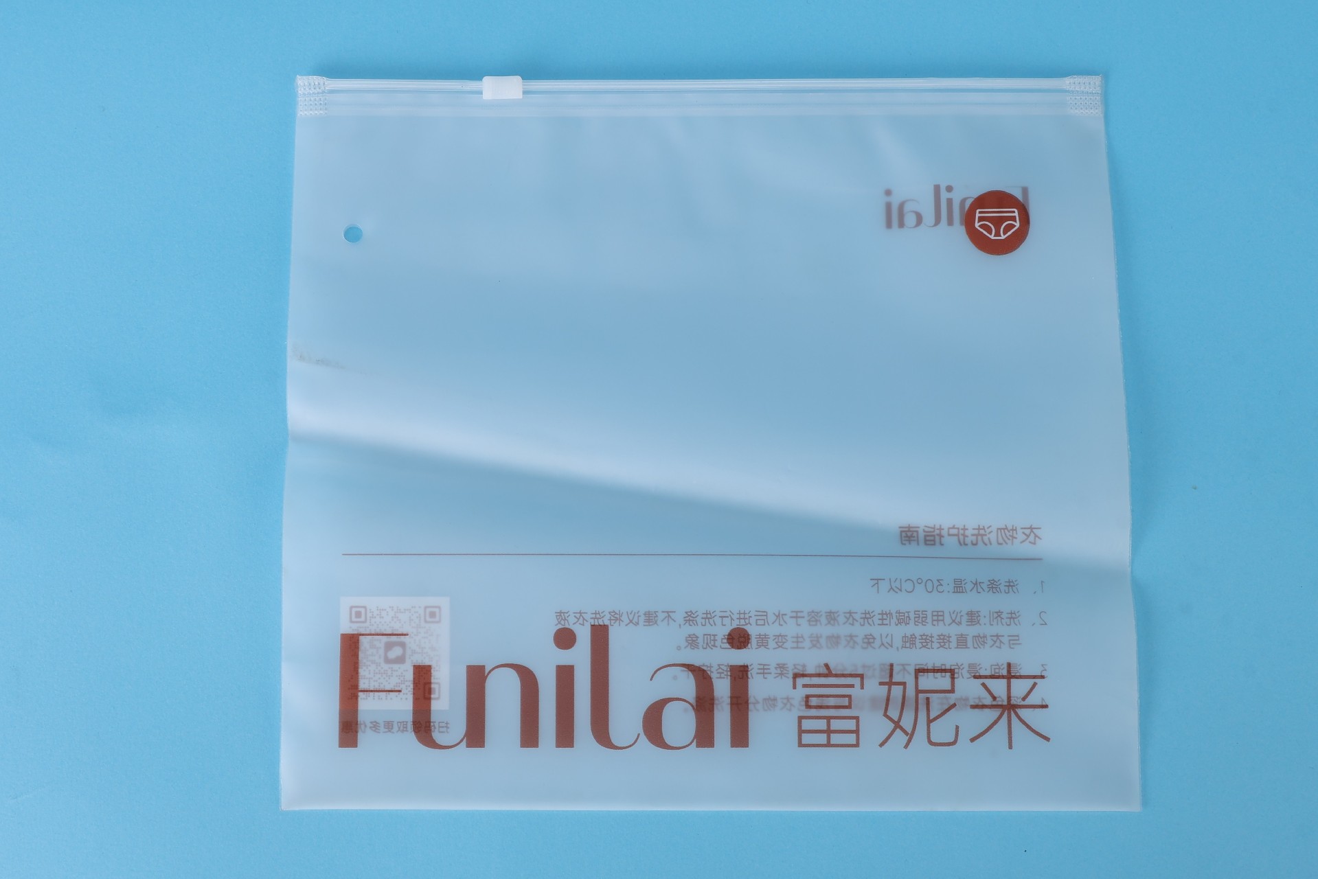 Custom printed zipper bag produced for an apparel brand